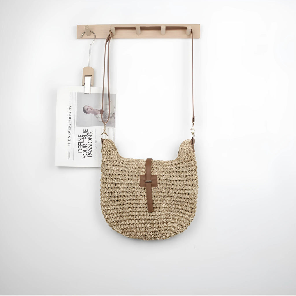 Beige handmade woven crossbody bag with a sandwich pocket and adjustable shoulder strap.