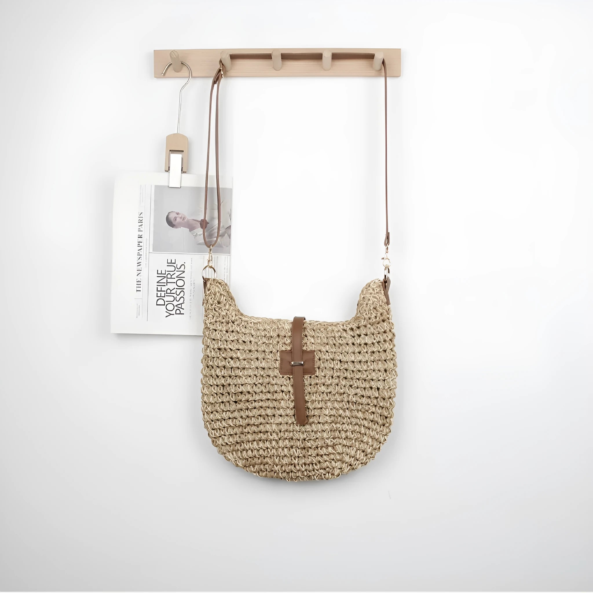 Beige handmade woven crossbody bag with a sandwich pocket and adjustable shoulder strap.
