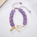 Women's woven bracelet with 6mm aquamarine beads and butterfly design on a wrist.