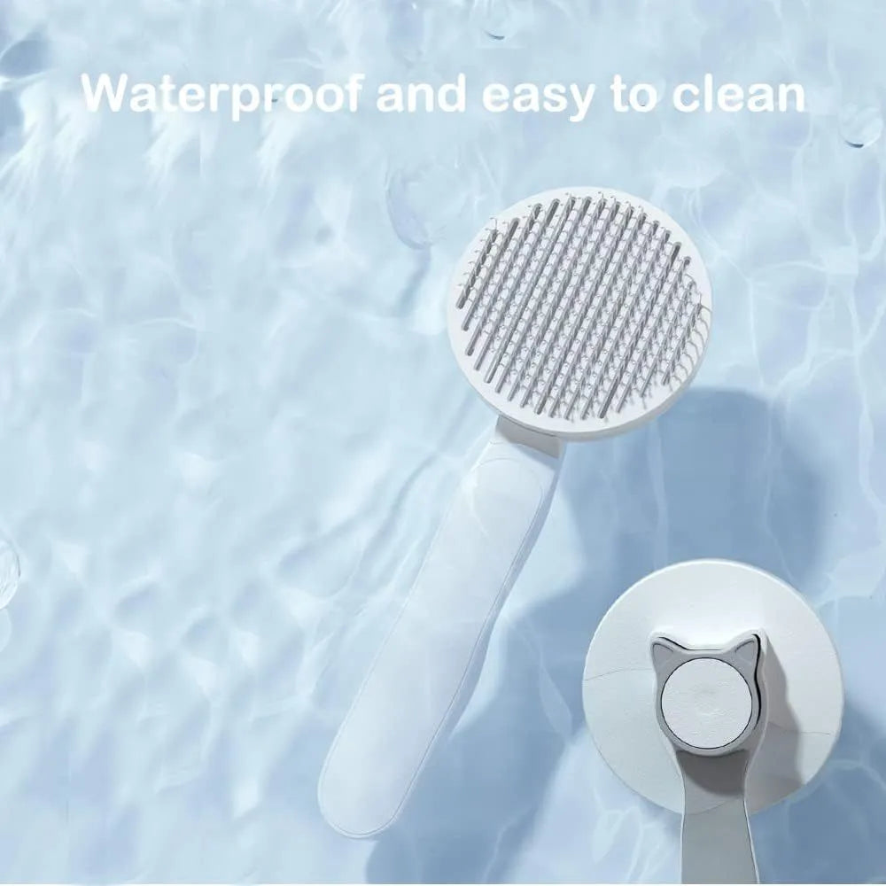 Blue self-cleaning cat brush with rubber-tipped metal pins and ergonomic handle for pet grooming