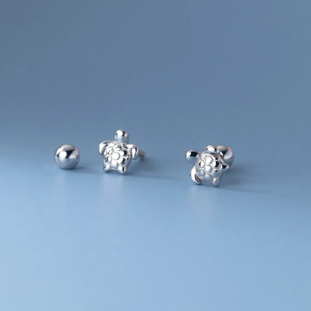 Small 925 sterling silver turtle stud earrings with thread line detail, shown in gold and silver colour options