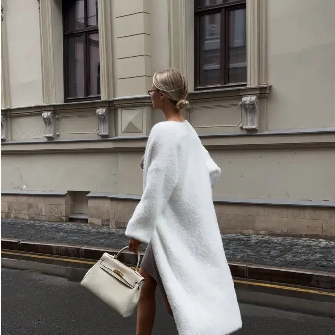 White women's cardigan sweater jacket with extended length and loose fit