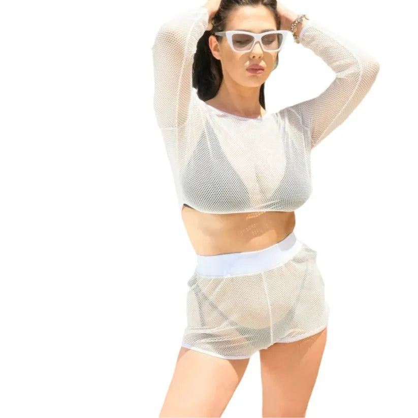 White women's beach swimsuit set with transparent straps and a matching skirt.