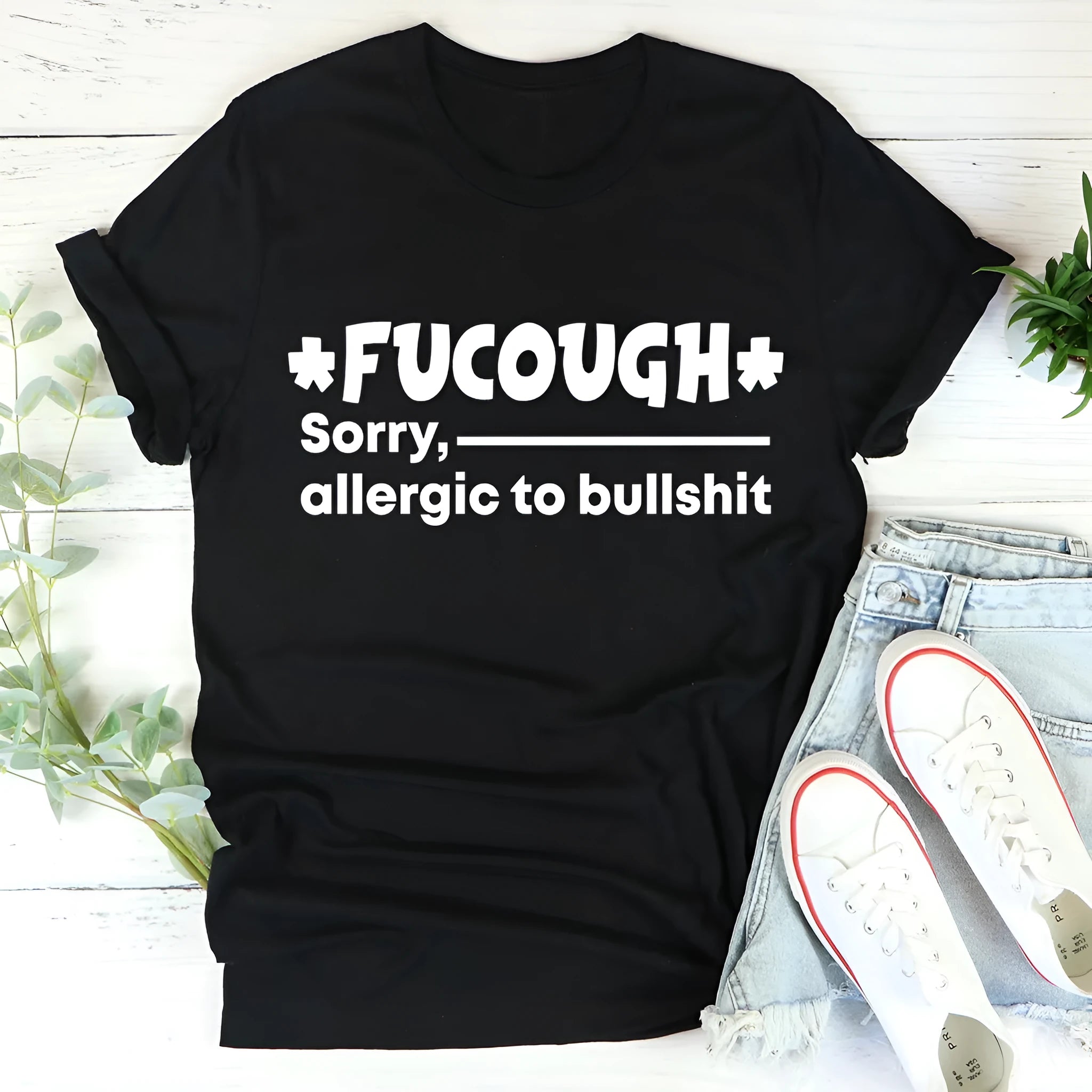 Black cotton loose fit t-shirt with short sleeves and round neck on hanger