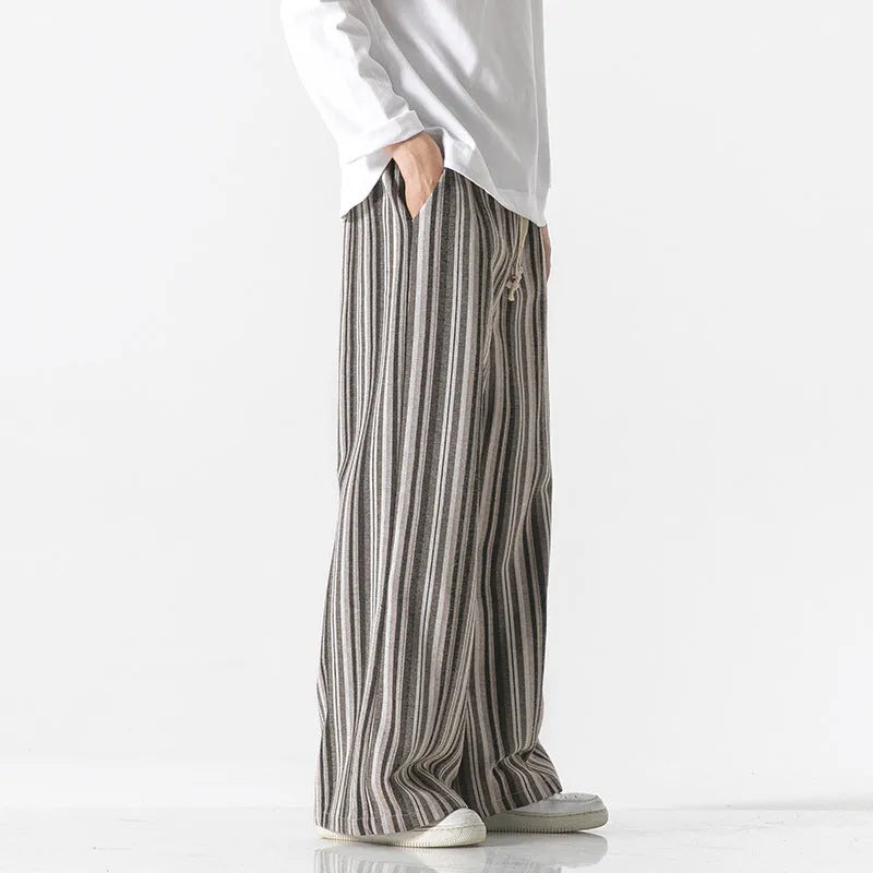Man wearing vintage stripe loose straight leg cotton blend mopping pants in khaki colour.