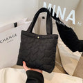 Large capacity women's shoulder bag in Oxford fabric with double-joint straps, bucket shape, and phone pocket.