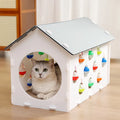 Plastic integrated cat scratch board, nest, and tunnel toy with a bell ball