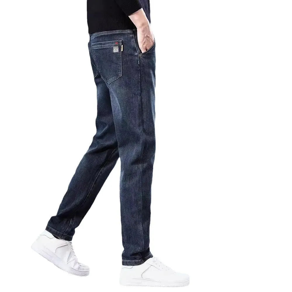 Blue grey slim straight loose casual trousers on a hanger, showing mid waist and zipper fly.
