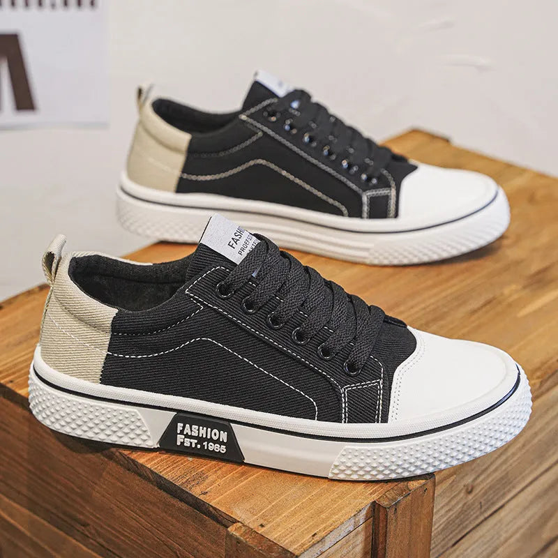 Men's low-top casual canvas skateboard shoes in blue with round toe and front lace-up closure.