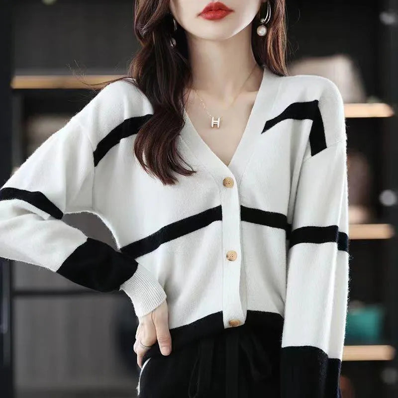 Women's slim fit striped V-neck knitted cardigan in a 3D pattern on a hanger.