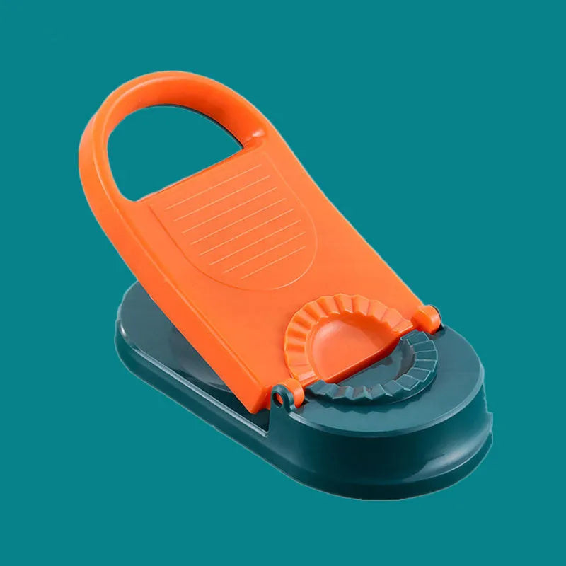 Orange and white plastic dumpling maker tool with ergonomic handle and hanging hole