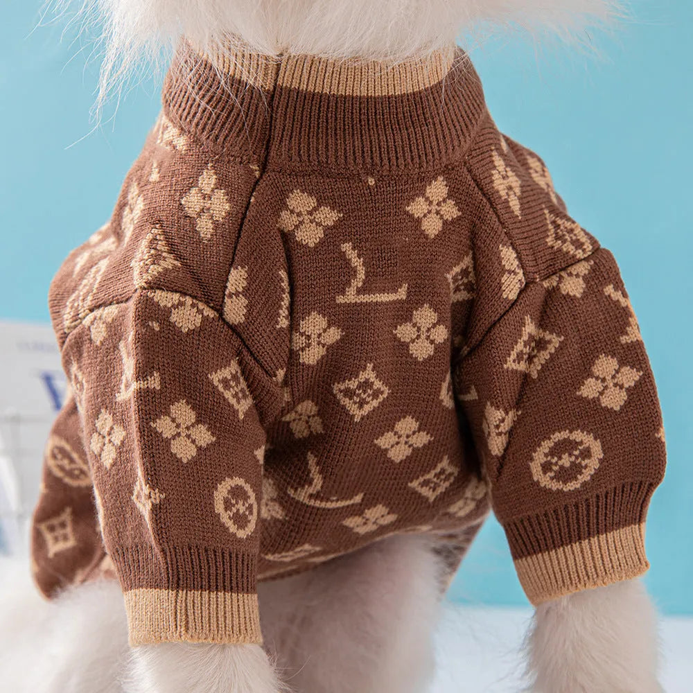 A thick knitted wool dog sweater shown in a two-tone colour, sized for a small breed.