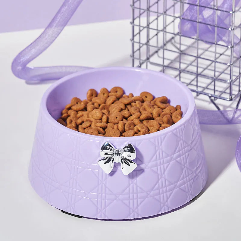 Pet food bowl with diamond pattern and a decorative bow design in a choice of colours.