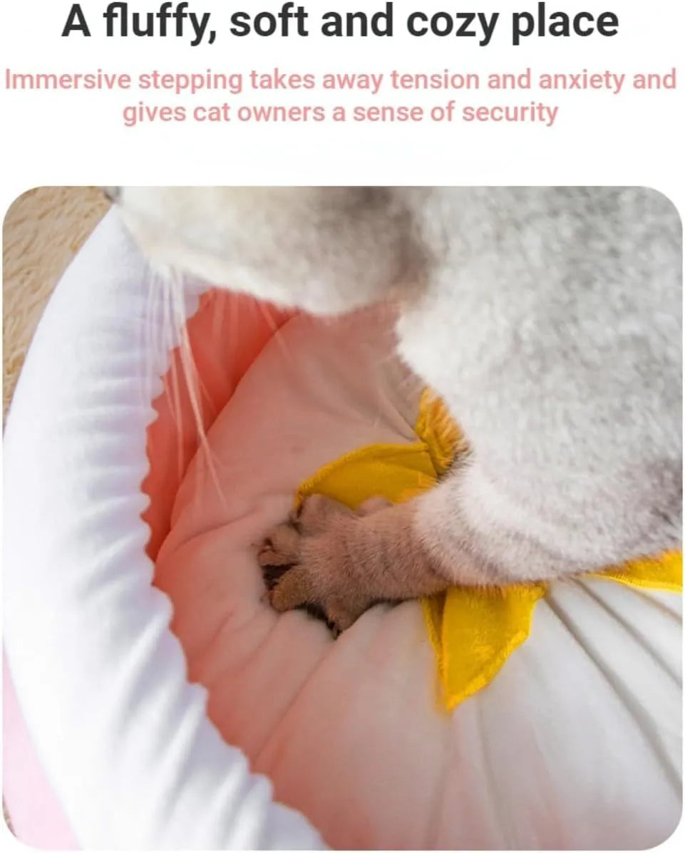 A pink magic honey pot shaped cat sofa bed with a soft interior for a small pet.