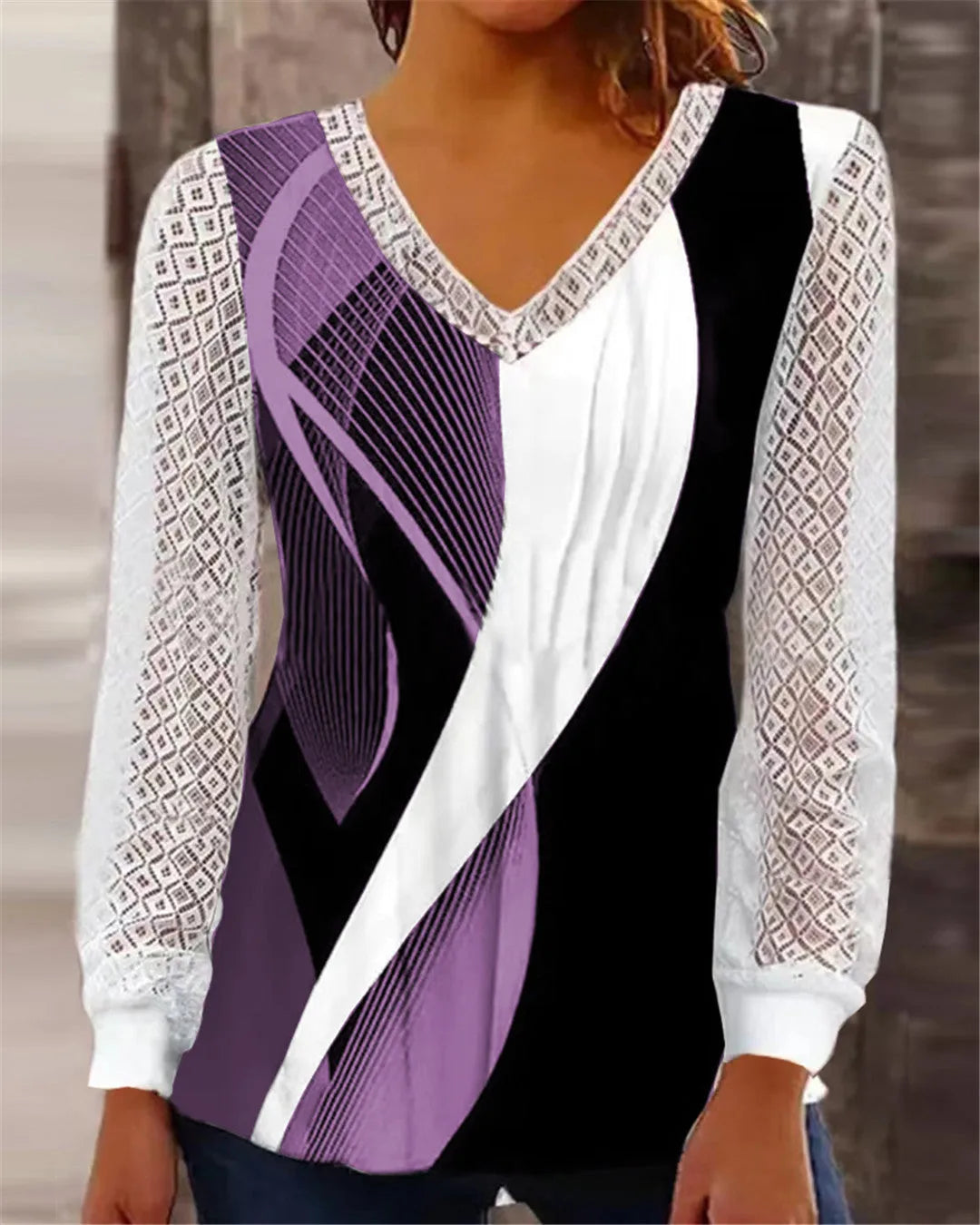Women's loose purple V-neck top with hollow-out lace print detail and long sleeves.