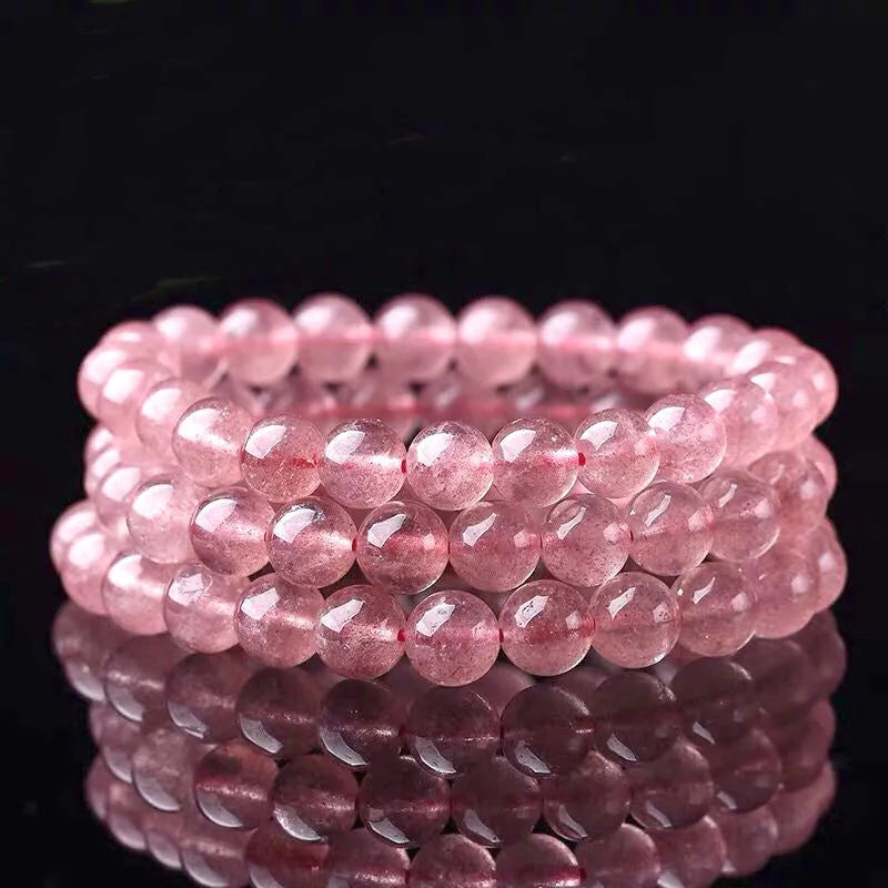 Women's fashion bracelet with polished strawberry quartz crystal beads.