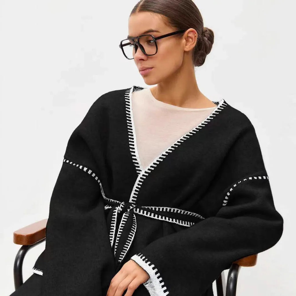 Loose lace-up knitted cardigan sweater coat in camel colour showing front detail