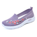 Women's embroidered woven sports pumps in wine red with a low flat heel and round toe.
