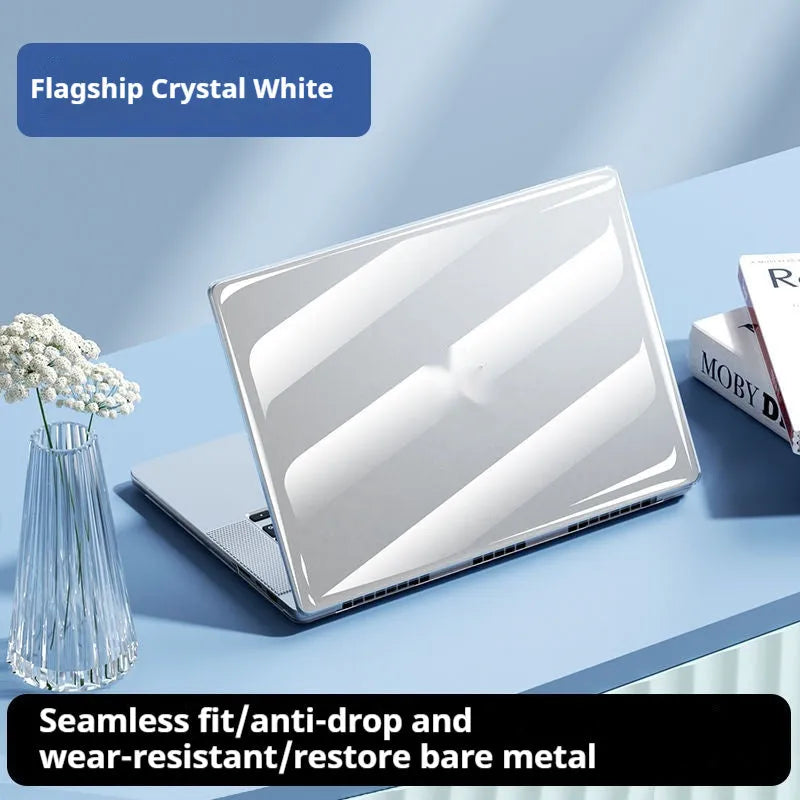 Transparent plastic protective shell for a MacBook laptop on a table.