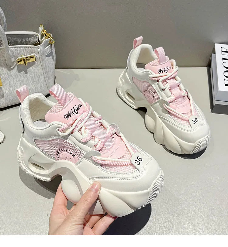 Women's pink casual sneakers with cross straps and thick platform sole