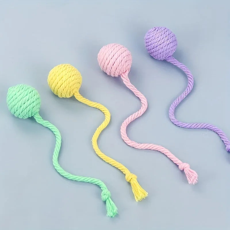 Fabric cat toy ball with rope attached in green, pink, purple, or yellow colours