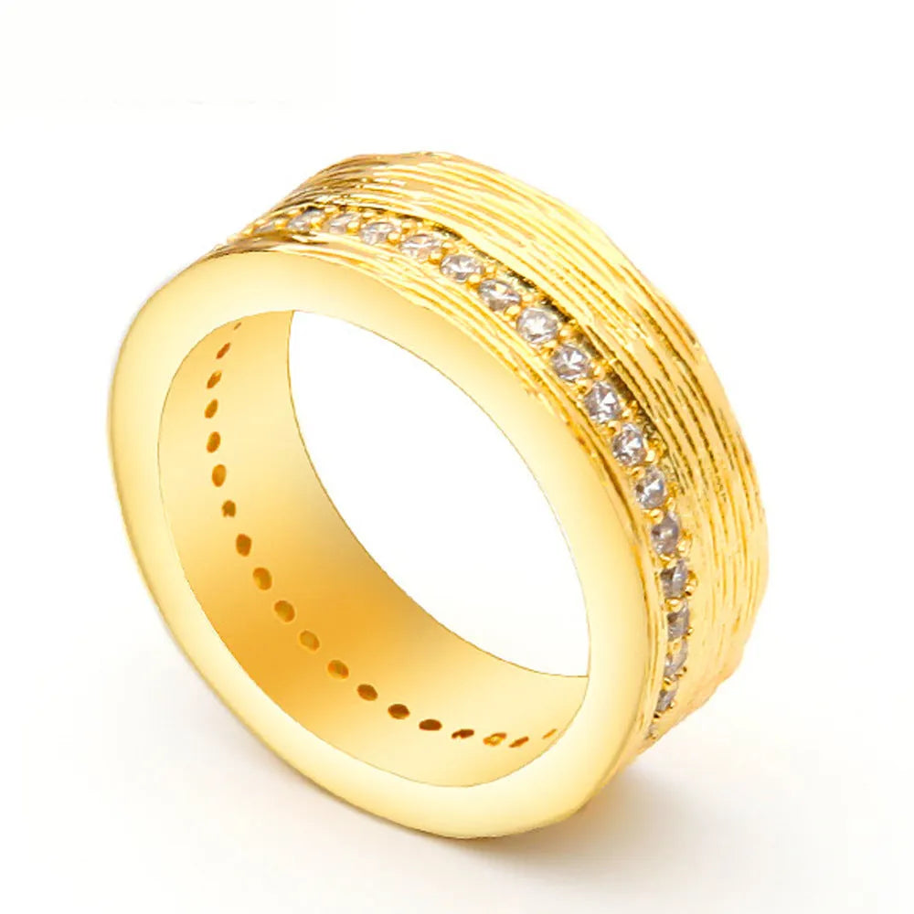 Gold geometric women's zircon ring on a copper base, shown in size 7.