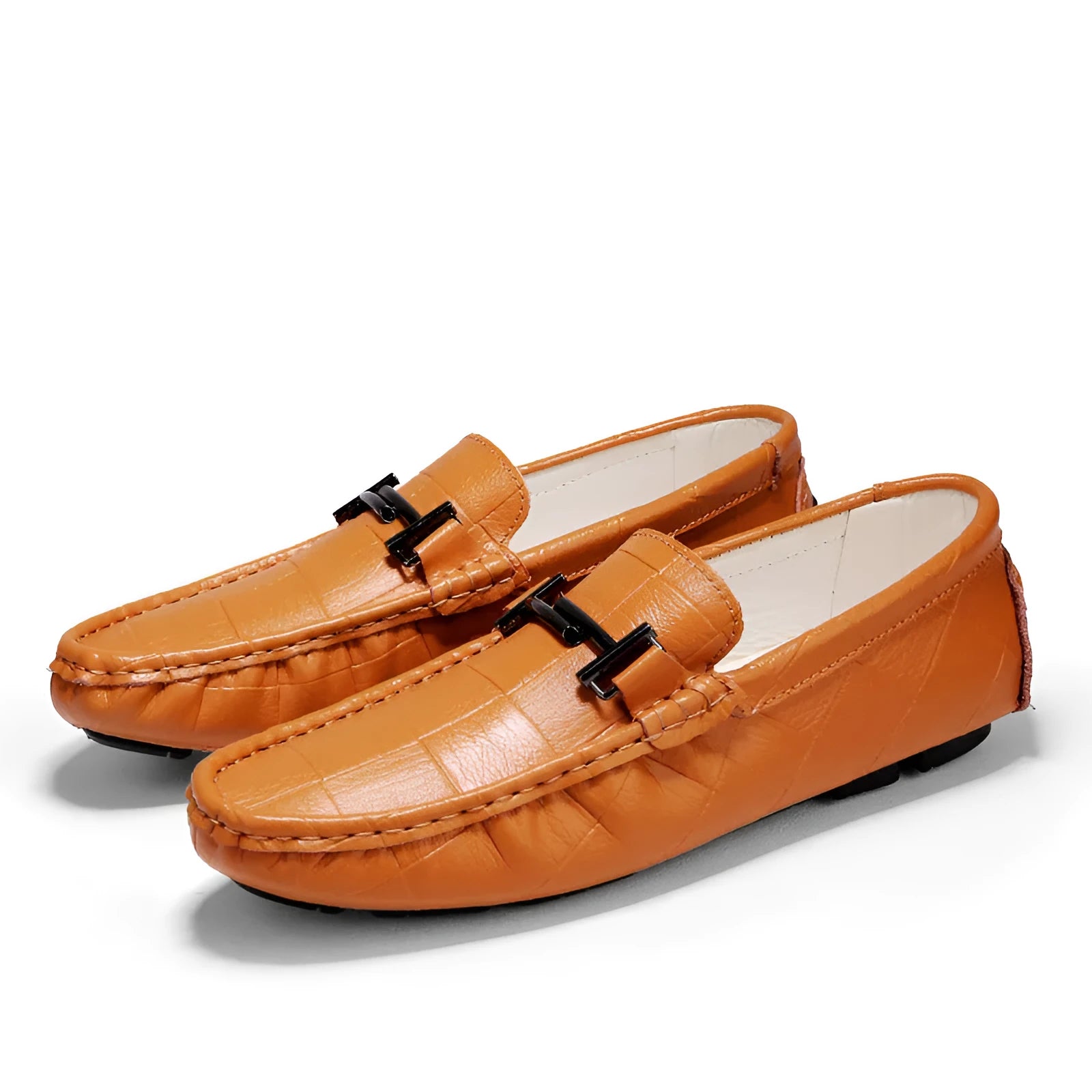 Men's black leather casual shoes with a silver belt buckle detail on the low-cut upper.