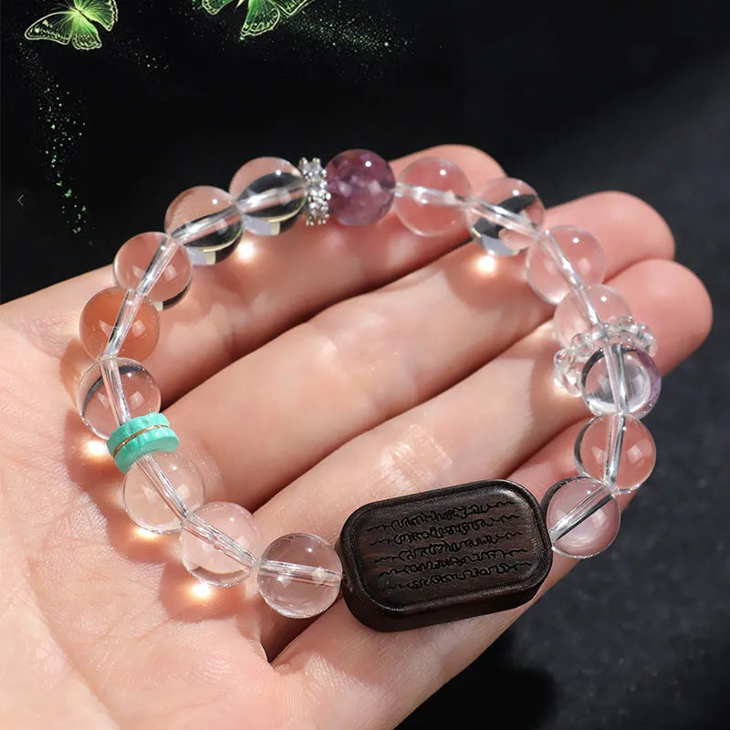 Natural white crystal ebony five warp bracelet on wrist showing handmade ethnic design