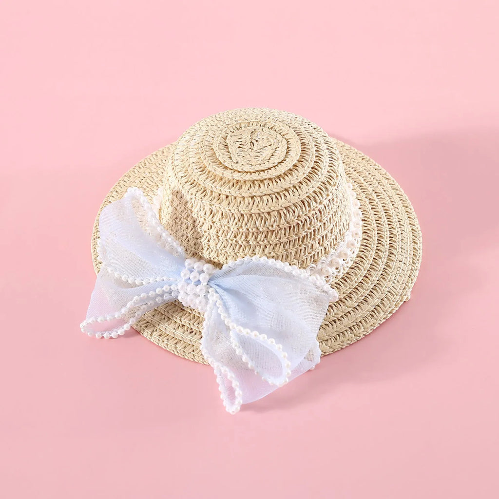 Pink pearl bow woven straw hat for a cat, shown in a princess style on a blank background.