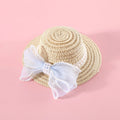 Pink pearl bow woven straw hat for a cat, shown in a princess style on a blank background.