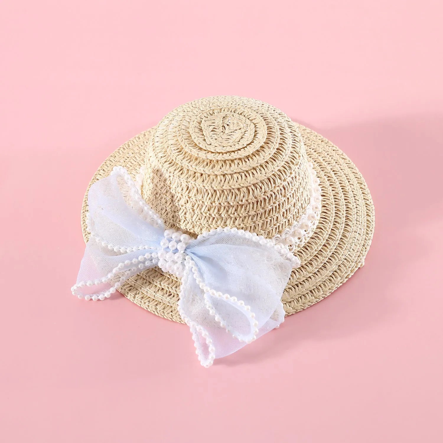Pink pearl bow woven straw hat for a cat, shown in a princess style on a blank background.