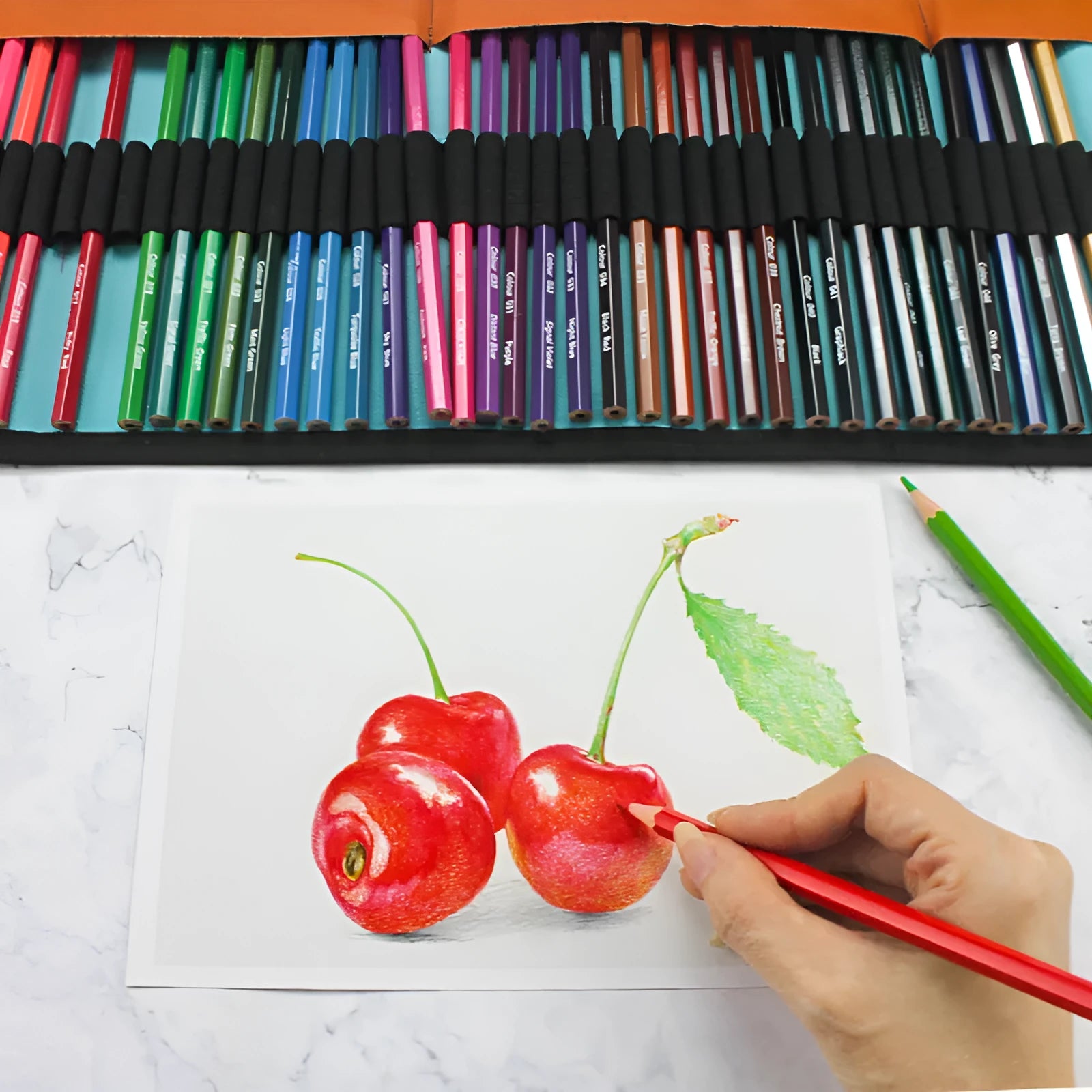 Set of 50 wooden coloured pencils in a box with a pencil case, showing vibrant colours and basswood casings.