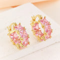 Women's geometric U-shaped earrings with round black zirconium stones and gold electroplated copper construction