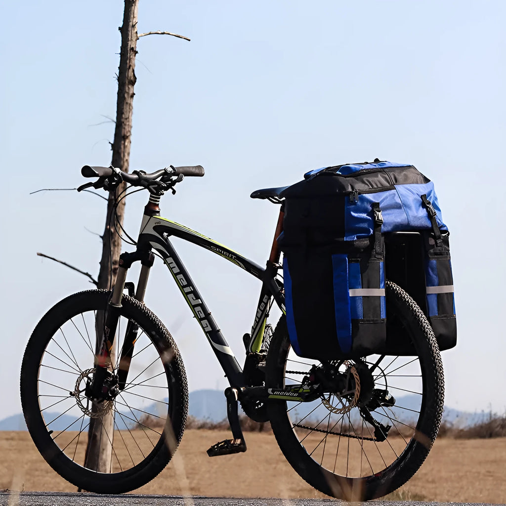 Rhinoceros 70-litre bicycle rear storage bag mounted on touring bicycle frame in blue colour option