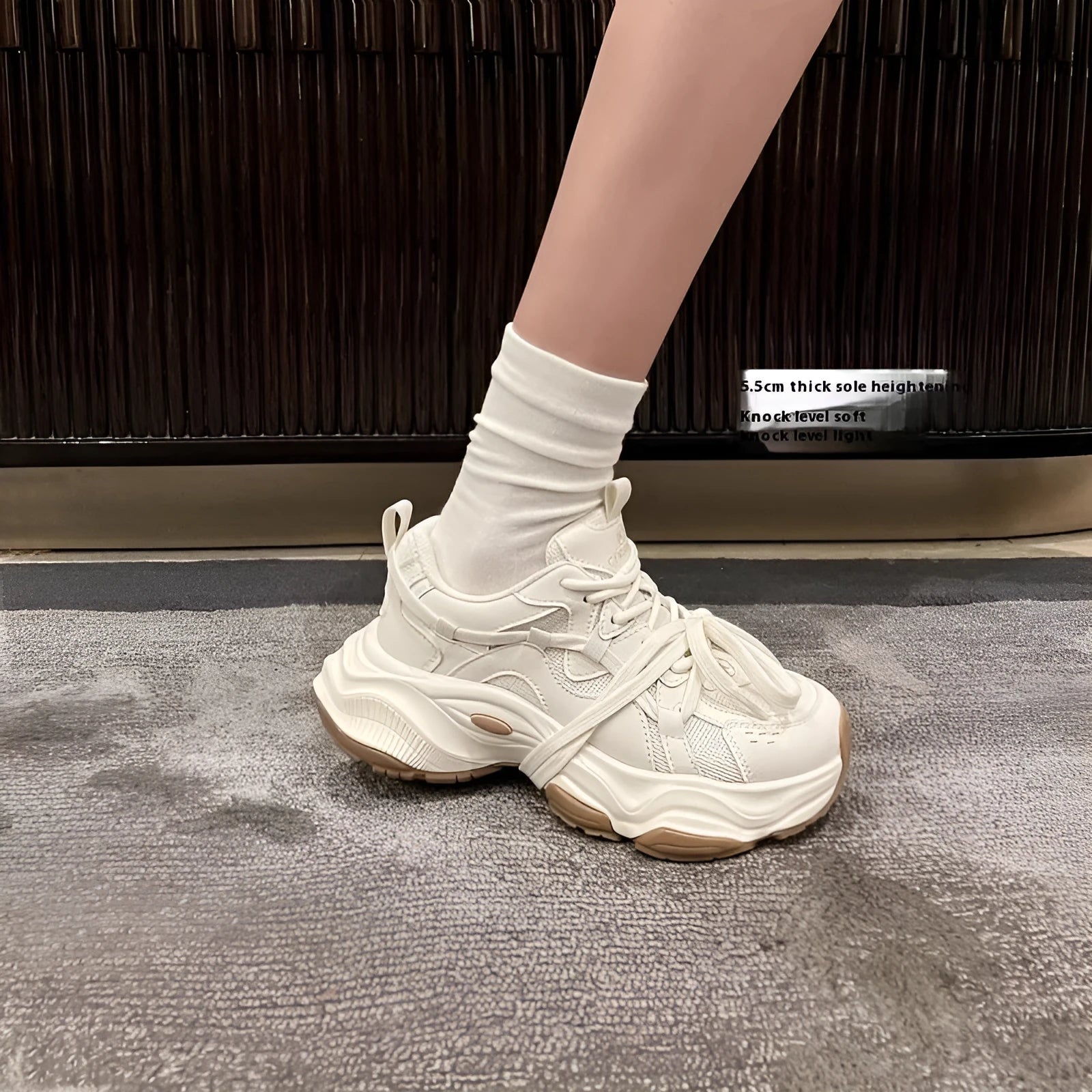 Women's beige platform sneaker with round toe and lace-up front on a white background.