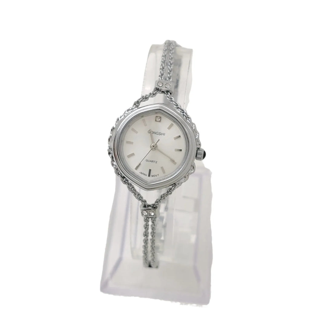 Women's Mori style quartz watch in gold or silver with a 25mm dial and chain strap.