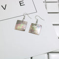 Geometric shell earrings in square panther or rectangular shell designs with natural finish