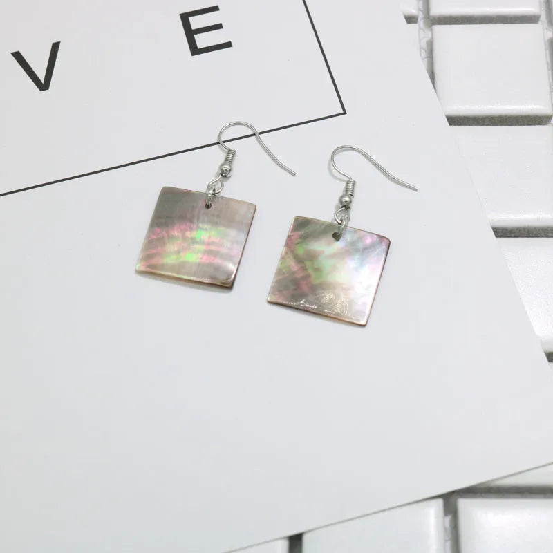 Geometric shell earrings in square panther or rectangular shell designs with natural finish