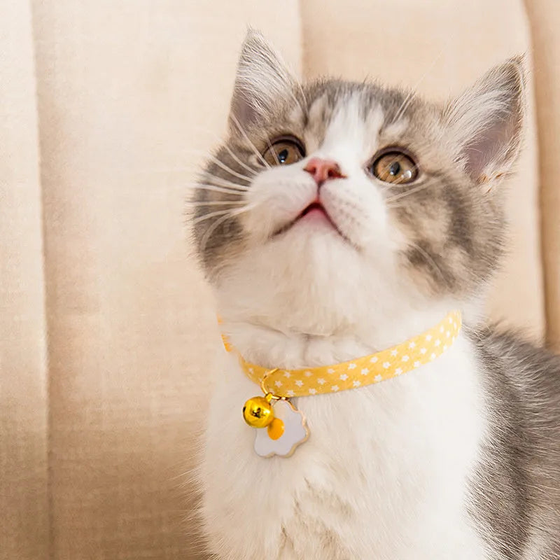 Green adjustable cat collar with bell pendant and bow tie attachment for small dogs