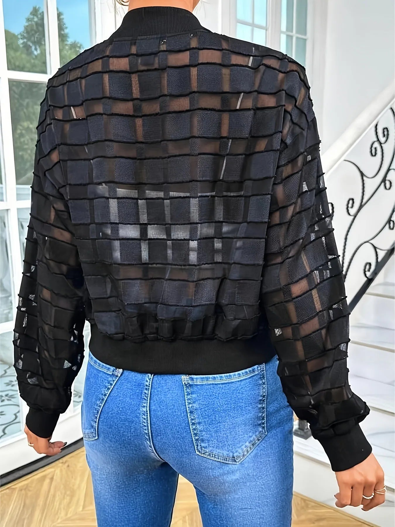 Women's black semi-transparent geometric pattern jacket with front zipper and long sleeves