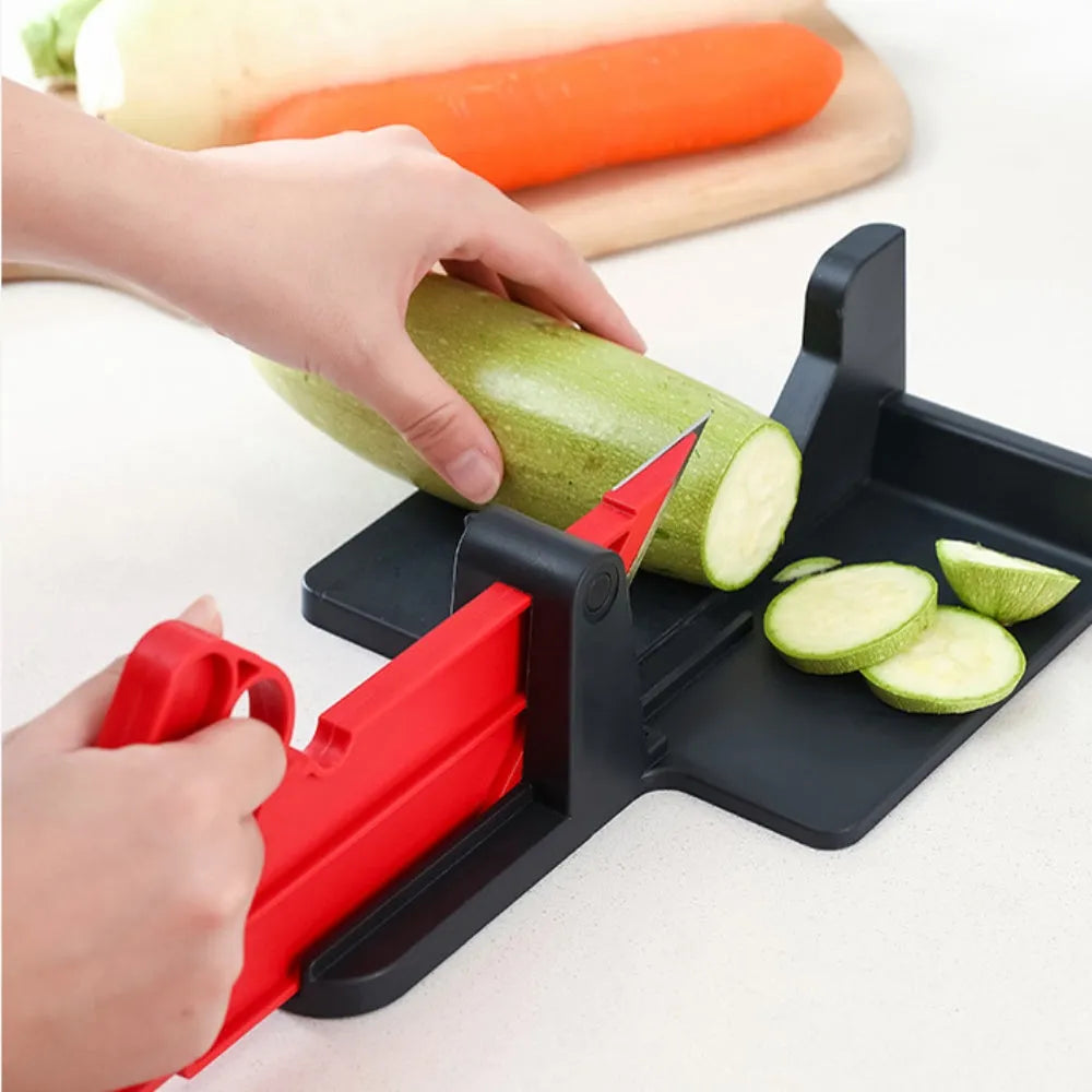 Green vegetable cutter with stainless steel blades for carrot and potato slicing in kitchen