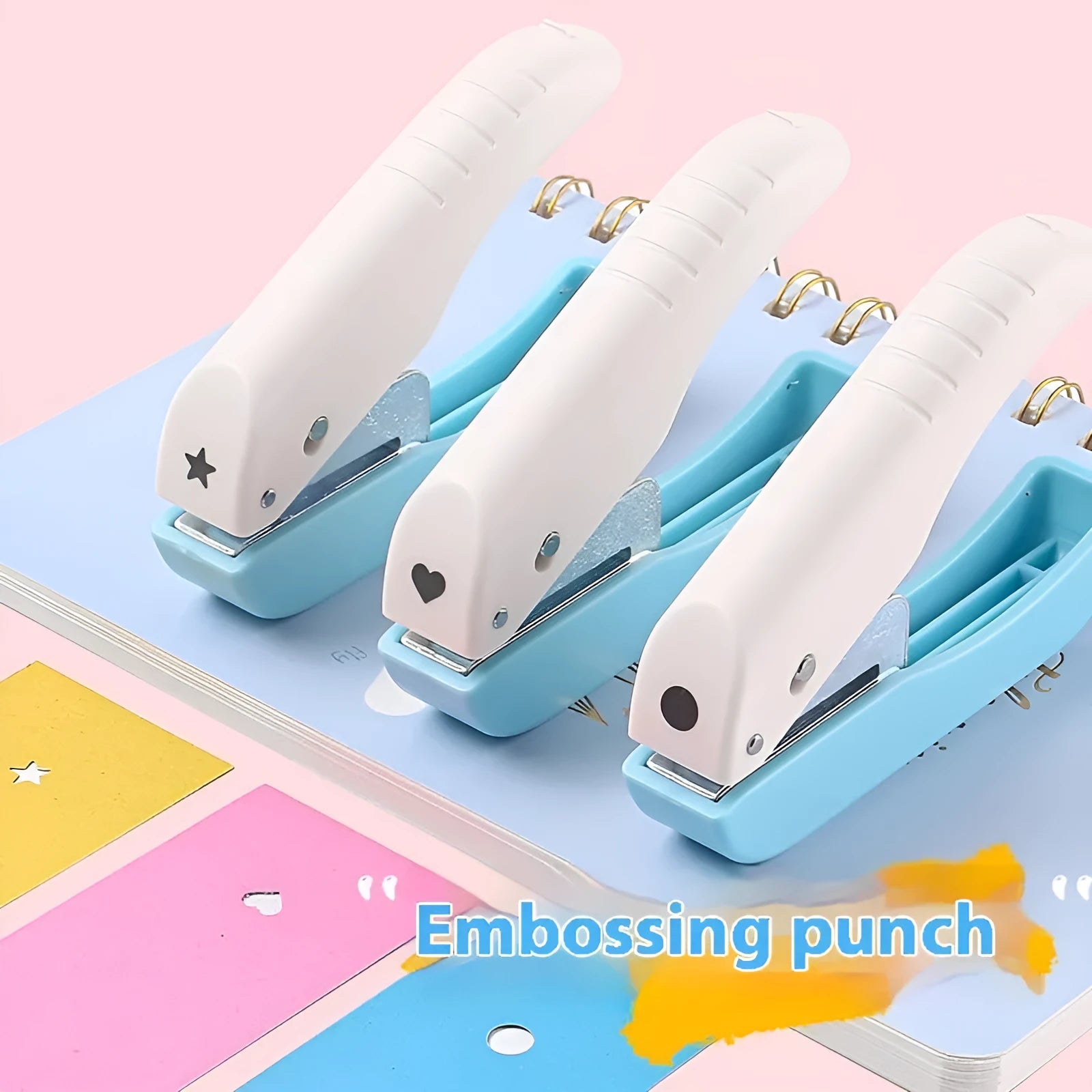 Small manual handheld punching machine with embossed love, star, and round shape cutters for paper crafts.