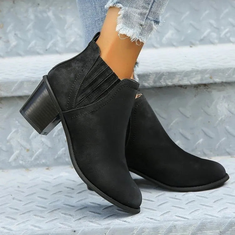 Women's black pointed toe ankle boots with a thick square low heel, made of artificial PU.