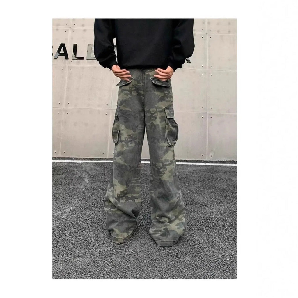Cotton-blend cargo trousers in a washed camouflage pattern with multiple pockets, shown in colour K0915.