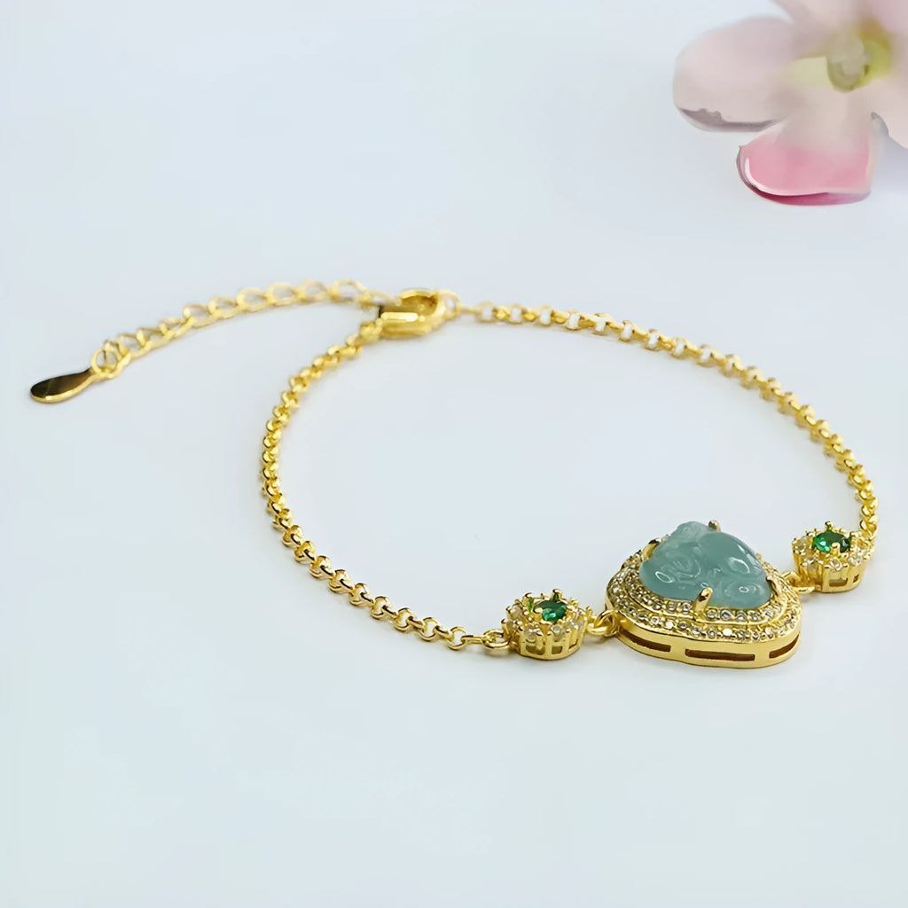 Emerald blue water jade bracelet with inlaid Maitreya Buddha carving, women's jewellery accessory.