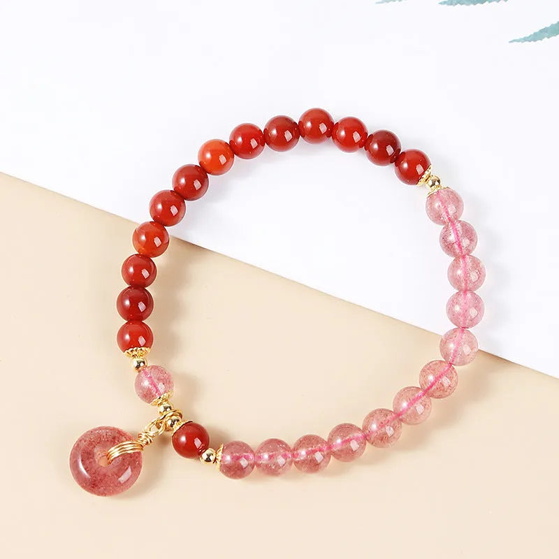 Green crystal bracelet with adjustable string closure on wrist