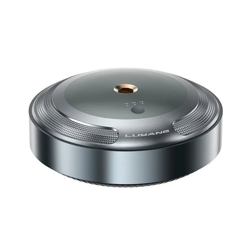 Automatic car air freshener diffuser with zinc alloy shell and included fragrance bottles on a dashboard.
