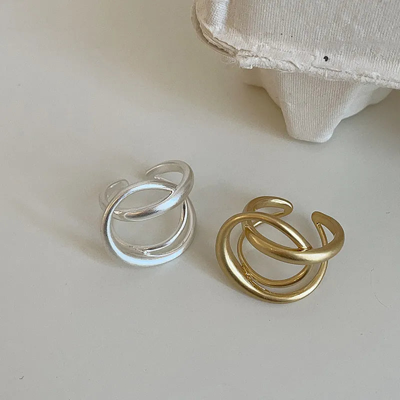 Three-dimensional interlaced matte metal open ring with geometric design in gold or silver electroplated finish