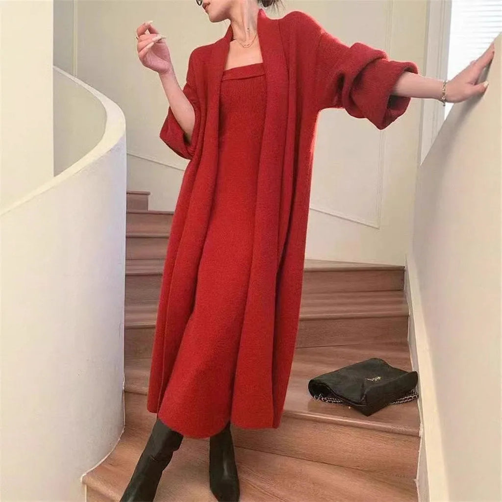 Women's grey knitted cardigan and dress two-piece suit set on a hanger.