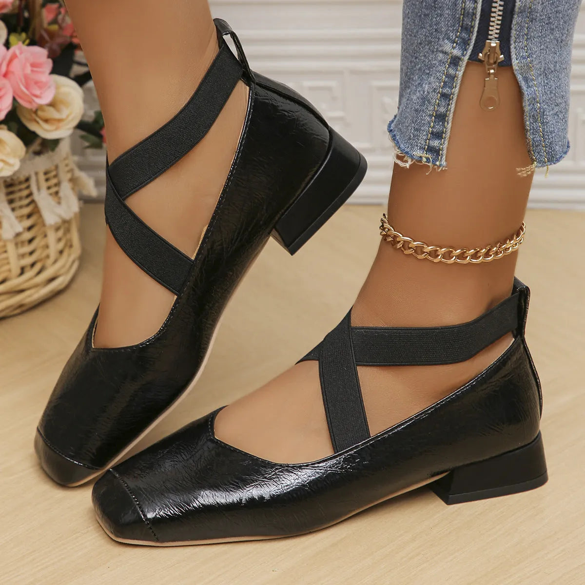 Gold slip-on evening pumps with a flared skirt collar, square toe and low rubber sole.